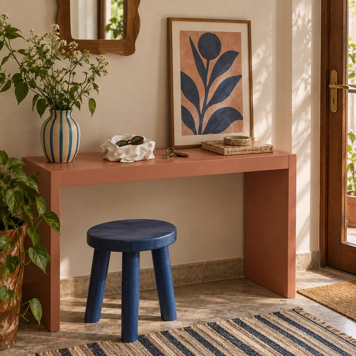 AI-styled room idea: Small white Cloth Bowl with sunglasses on a salmon entry console