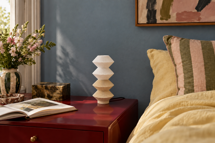 AI-styled room idea: Beige Kaiden lamp on a red bedside table with yellow bedding