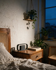 Arch Desk Holder – at night on a bedside table