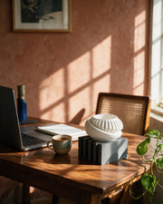 Bar Rest Display Stand – on a work desk in morning sun