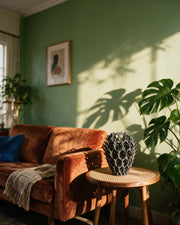 Branch Relief Vase – on a side table at golden hour