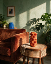 Bubble Column Vase – on a side table at golden hour