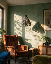 Cell Bell Pendant Light – on a side table at golden hour
