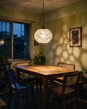 Cell Cluster Pendant Light – at night on a bedside table