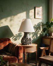 Cell Lattice Table Lamp – on a side table at golden hour