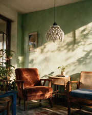 Claw Petal Pendant Light – on a side table at golden hour