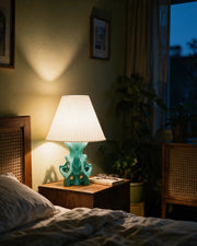 Coral Branch Table Lamp – at night on a bedside table
