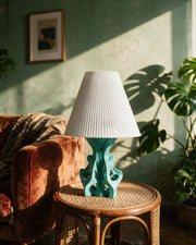 Coral Branch Table Lamp – on a side table at golden hour