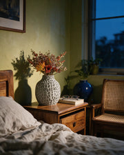 Coral Pore Vase – at night on a bedside table