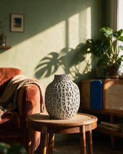 Coral Pore Vase – on a side table at golden hour