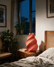 Coral Twist Vase – at night on a bedside table