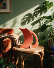 Crescent Watering Can – on a side table at golden hour