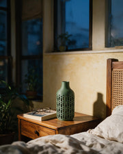 Dash Slot Vase – at night on a bedside table
