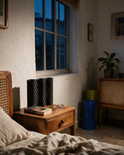 Diagonal Rib Vase – at night on a bedside table