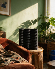 Diagonal Rib Vase – on a side table at golden hour