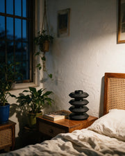 Disc Tier Vase – at night on a bedside table