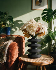 Disc Tier Vase – on a side table at golden hour