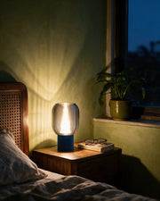 Dome Rib Mini Lamp – at night on a bedside table