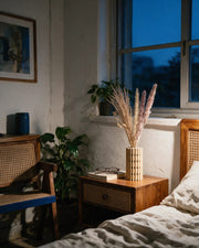 Dot Column Vase – at night on a bedside table