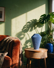 Facet Column Vase – on a side table at golden hour