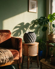 Faceted Orb Planter – on a side table at golden hour