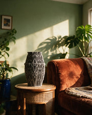 Filigree Web Vase – on a side table at golden hour