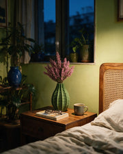 Fin Blade Vase – at night on a bedside table