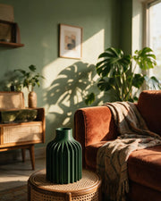Fin Column Vase – on a side table at golden hour