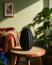 Fin Oval Vase – on a side table at golden hour