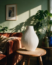 Fine Rib Teardrop Vase – on a side table at golden hour