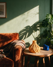 Flame Bud Vase – on a side table at golden hour