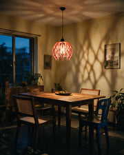 Flame Cage Pendant Light – at night on a bedside table