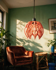 Flame Cage Pendant Light – on a side table at golden hour