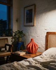 Flame Fin Vase – at night on a bedside table