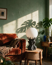 Flame Globe Table Lamp – on a side table at golden hour