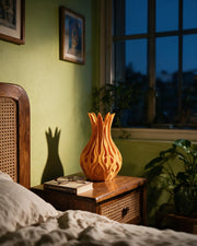 Flame Petal Vase – at night on a bedside table