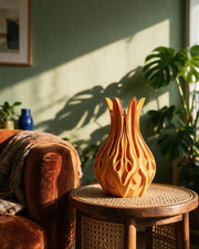 Flame Petal Vase – on a side table at golden hour