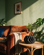 Flame Relief Planter – on a side table at golden hour