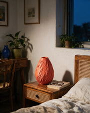 Flame Swirl Vase – at night on a bedside table