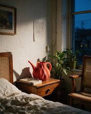 Flame Watering Can – at night on a bedside table