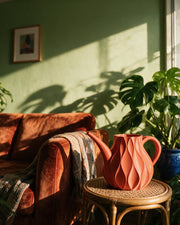 Flame Watering Can – on a side table at golden hour