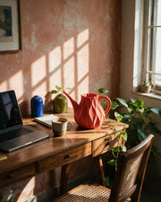 Flame Watering Can – on a work desk in morning sun