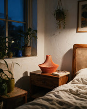 Flared Pleat Vase – at night on a bedside table