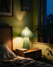 Fluted Mushroom Table Lamp – at night on a bedside table