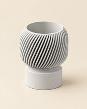 Fluted Pedestal Planter – three-quarter studio view