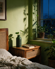 Herringbone Vase – at night on a bedside table