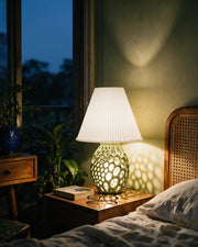 Honeycomb Base Table Lamp – at night on a bedside table