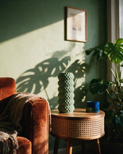 Honeycomb Cylinder Vase – on a side table at golden hour