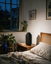Knob Capsule Vase – at night on a bedside table