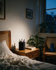 Knurl Pen Cup – at night on a bedside table